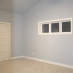 1502 Maple Hills Owner's Bedroom. Cathedral Ceiling. Painted Woodwork. 3-Wide Transom Window. 5-Panel Stacked Doors.