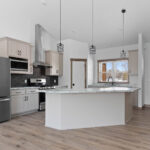 1606 Mapleridge Circle Kitchen. Painted Flat Panel Custom Cabinets. Tiled Backsplash.