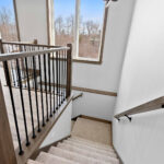 1606 Mapleridge Circle Stairs. Plain Black Square Iron Balusters with LJ Smith LJ-4000 Newel Posts.