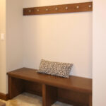 3424 Schubert Back Entry Bench + Coat Hooks. Stained Maple. Ceramic Tile Floors.