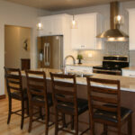 3424 Schubert Kitchen. Quartz Countertops. Subway Tile Backsplash. Painted Perimeter Cabinets with Stained Maple Island.