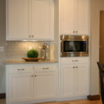 3424 Schubert Kitchen. Quartz Countertops. Subway Tile Backsplash. Painted Perimeter Cabinets with Stained Maple Island.