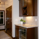3435 Schubert Dry Bar. X-Stytle Wine Storage Rack. Under-Counter Refrigerator Beverage Center. Subway Tile Backsplash. Stained Maple Flat Panel Custom Cabinets.