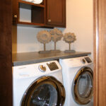 3435 Schubert Laundry. Folding Counter Above Washer & Dryer. Sheet Vinyl Flooring.