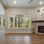 3492 Yorkshire Great Room + Dinette + Stacked Stone Fireplace to Mantel Height. Luxury Vinyl Plank Floors. Painted Woodwork.