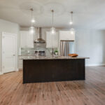 3492 Yorkshire Kitchen + Dinette. Painted Perimeter Cabinets with Espresso Stained Maple Island. Granite Countertops. Tiled Backsplash. Luxury Vinyl Plank Floors.