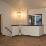 514 Rosemary Foyer + Stairs. Half Wall with Wood Cap.