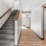 6067 Governors Woods Foyer. Half Wall with Stained Maple Cap.