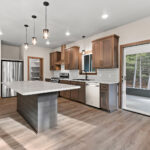 6067 Governors Woods Kitchen. Shiplap Island Base. Stained Maple Flat Panel Custom CAbinets. Luxury Vinyl Plank Floors. Subway Tile Backsplash.