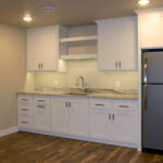 7714 Saint Andrews Basement Wet Bar. Floating Shelves. Granite Countertops. Painted Flat Panel Custom Cabinets.