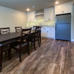 7714 Saint Andrews Basement Wet Bar. Floating Shelves. Granite Countertops. Painted Flat Panel Custom Cabinets.