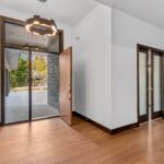 7736 Turnberry Foyer. Modern Front Door. Direct Set Sidelites.