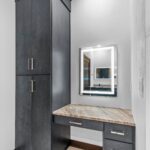 7736 Turnberry Owners Bathroom Makeup Vanity. Slab Front Modern Cabinets. Lighted Mirrors. Quartz Countertsops. Ceramic Tile Floors.