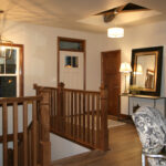 1726 Symphony Heights Foyer + Stairs + Stained Maple Square Wood Balusters