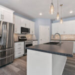 4976 Plum Bottom Rd Kitchen. Under-Cabinet LED Strip Lighting. Luxury Vinyl Plank Floors. Center Island. Painted White Cabinets. Microwave / Range Hood OTR Over-the-Range. Slide-In Range with Dual Ovens. Laminate Countertops. Corner Walk-In Pantry.