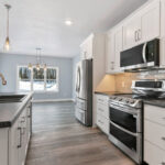 4976 Plum Bottom Rd Kitchen. Under-Cabinet LED Strip Lighting. Luxury Vinyl Plank Floors. Center Island. Painted White Cabinets. Microwave / Range Hood OTR Over-the-Range. Slide-In Range with Dual Ovens. Laminate Countertops.