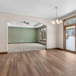 3597 E Hank Dining. Pella Patio Door with Blinds in Glass.