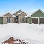 3597 E Hank Exterior. James Hardie Fiber Cement Siding. Woodgrain Overhead Garage Doors.