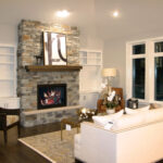 2411 Pristine Great Room + Fireplace with Stone to Ceiling Height + Raised Hearth Extenson. Wood Floors. Built-In Cabinets Flanking Fireplace. Beveled Tray Ceiling 36" Deep.