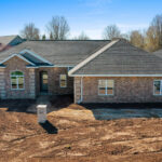 3320 Cottage Hill Exterior. Brick with Stone Quoin Corners. Stone Yard Light Address Pedestal.