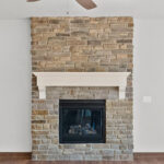 3320 Cottage Hill Fireplace. Floor-to-Ceiling Stone Surround with White Painted Mantel with Corbels.