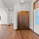 3320 Cottage Hill Foyer. Archway. Transom over Front Door. Luxury Vinyl Plank Floors.