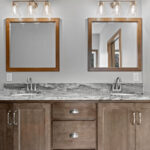 3320 Cottage Hill Owners Bathroom. Stained Maple Vanity Cabinet with Granite Countertops & Wood Framed Mirrors.