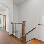 3320 Cottage Hill Stairs. Wall Niche. Archway. Plain Square Black Iron Metal Balusters.