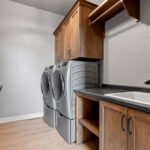 704 Royal St Pats Laundry. Washer and Dryer on Pedestal Drawers.
