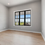 704 Royal St Pats Office. Luxury Vinyl Plank Floors. Black windows with white painted trim.