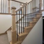6170 Saint Patrick Stairs. Square Edged False Endcaps & Handrail. Plain Square Iron Metal Balusters. 4x4 Boxed Newel Posts.