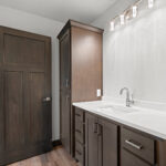 116 Cortland Owners Bathroom. Quartz Countertops. Stained Maple Cabinets.