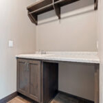 2966 Sugar Bush Laundry. Folding Counter Open Below with Utility Sink. Hanging Pole & Shelf.