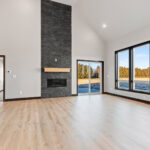 525 E Greenfield 2-Story Living Room & Stacked Stone Fireplace Surround. Luxury Vinyl Plank Floors.