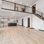 525 E Greenfield Living Room & Stairs. Black Iron Vertical Balusters. Stair Knee Wall. Luxury Vinyl Plank Floors. Stairway open to 2nd Floor Loft.