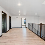525 E Greenfield Loft. Vertical Black Iron Balusters with LJ Smith LJ-4000 4x4 Stained Maple Newel Posts.