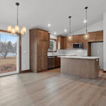 526 Rosemary Kitchen & Dinette. Custom stained maple cabinets. Full pantry cabinet. Center island. WilsonArt “Anzio Marble 5037” laminate countertops. Courtier “Camarilla Oak” Luxury Vinyl Plank floors.