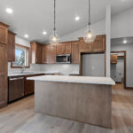 526 Rosemary Kitchen. Custom stained maple cabinets. Full pantry cabinet. Center island. WilsonArt “Anzio Marble 5037” laminate countertops. Courtier “Camarilla Oak” Luxury Vinyl Plank floors.