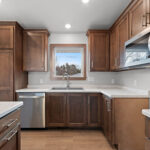 526 Rosemary Kitchen. Custom stained maple cabinets. Full pantry cabinet. Center island. WilsonArt “Anzio Marble 5037” laminate countertops. Courtier “Camarilla Oak” Luxury Vinyl Plank floors.