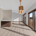 398 Red Tail Dining. Mid-Century Modern Revival. Interior Brick Walls. Large Windows to Floor. Built-In Wall Oven. Luxury Vinyl Plank Floors.