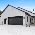 7730 Prestwick Exterior. DiamondKote LP Smartside White Vertical Board & Batten Siding. Black Flush Panel Overhead Garage Doors. Black Windows. Black Soffit & Black Fascia.
