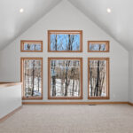 14421 N Paya Lake Rd Loft. Half wall with maple cap. 14421 N Paya Lake Rd Loft. Tesselation "Vogue" patterned carpeting.