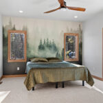 14421 N Paya Lake Rd Owners Bedroom. Evergreen wallpaper accent wall.